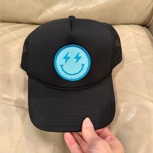 Black trucker hat with Blue smiley patch! Never worn!